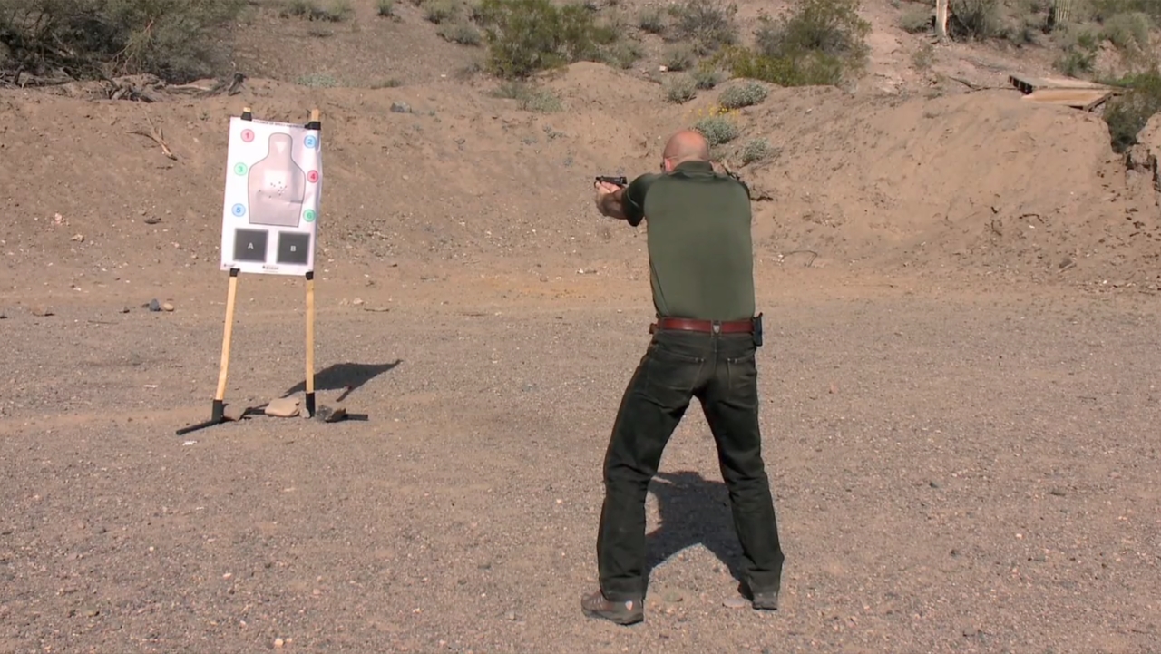 Man aiming at an outdoor target