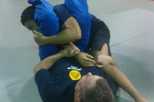 Bottom person holding guard now has immense control. He can snap the arm, sweep the other guy over, or quickly transition to a triangle choke, all within seconds.