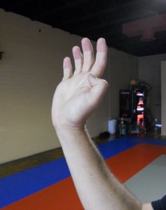 Many advocate this type of hand formation: bent wrist, splayed out and unsupported fingers.