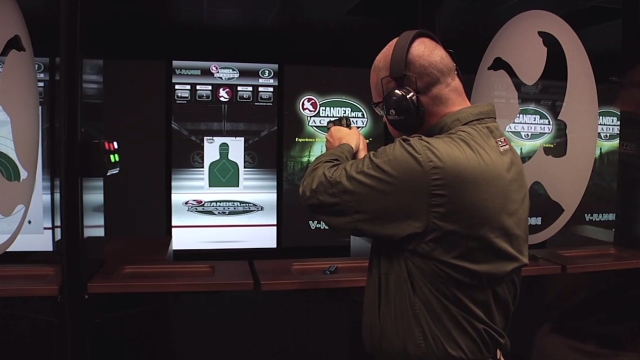 Man aiming a gun at a virtual target