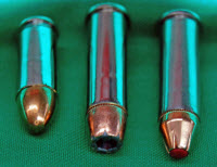 Left to right: full metal jacket round, traditional hollow point, and more modern personal-defense round with polymer tip.