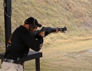Firing third shot in a rapid-fire sequence, author is still very much in control of recoil due to aggressive shooting stance.
