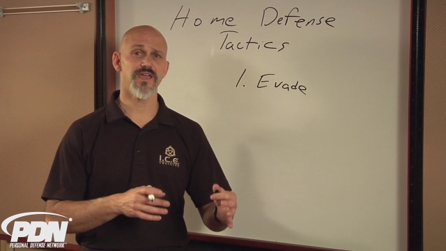 Man writing on a whiteboard about Minute Home Defense Tactics
