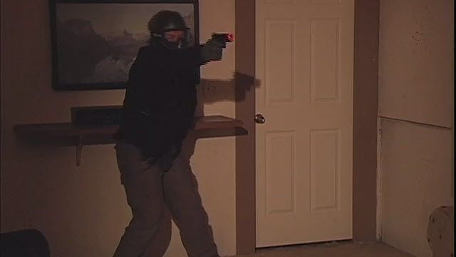 Person in a hold with a gun