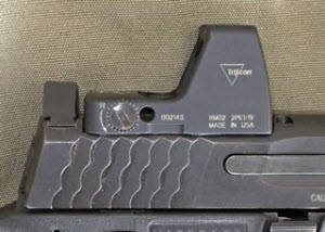 RDS mounted in front of rear sight. Problem is that this places the RDS closer to the ejection port and may cause more debris to get on the scope lens.