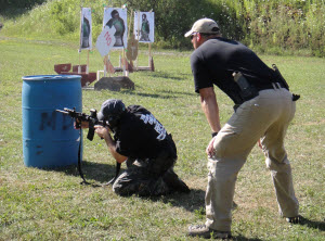 Coaching shooter on proper barricade tactics and bilateral weapon operation during MDTS Combative Carbine Skills course.