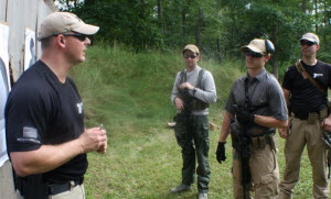 Discussing fundamental and combative marksmanship with students during combined pistol and carbine course.