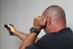 The eye index technique is simple to use, positions the hand in a protected place on the head, and illuminates both the threat and sight very well.