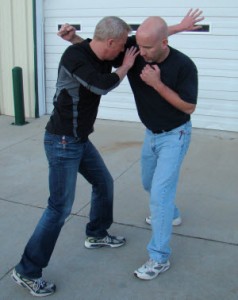Extending your arm between the attacker’s head and his fist allows it to function as an “off ramp,” preventing the punch from landing and guiding it harmlessly down toward your armpit.