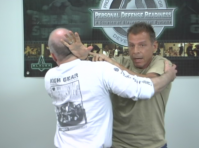 Two men practicing personal defense