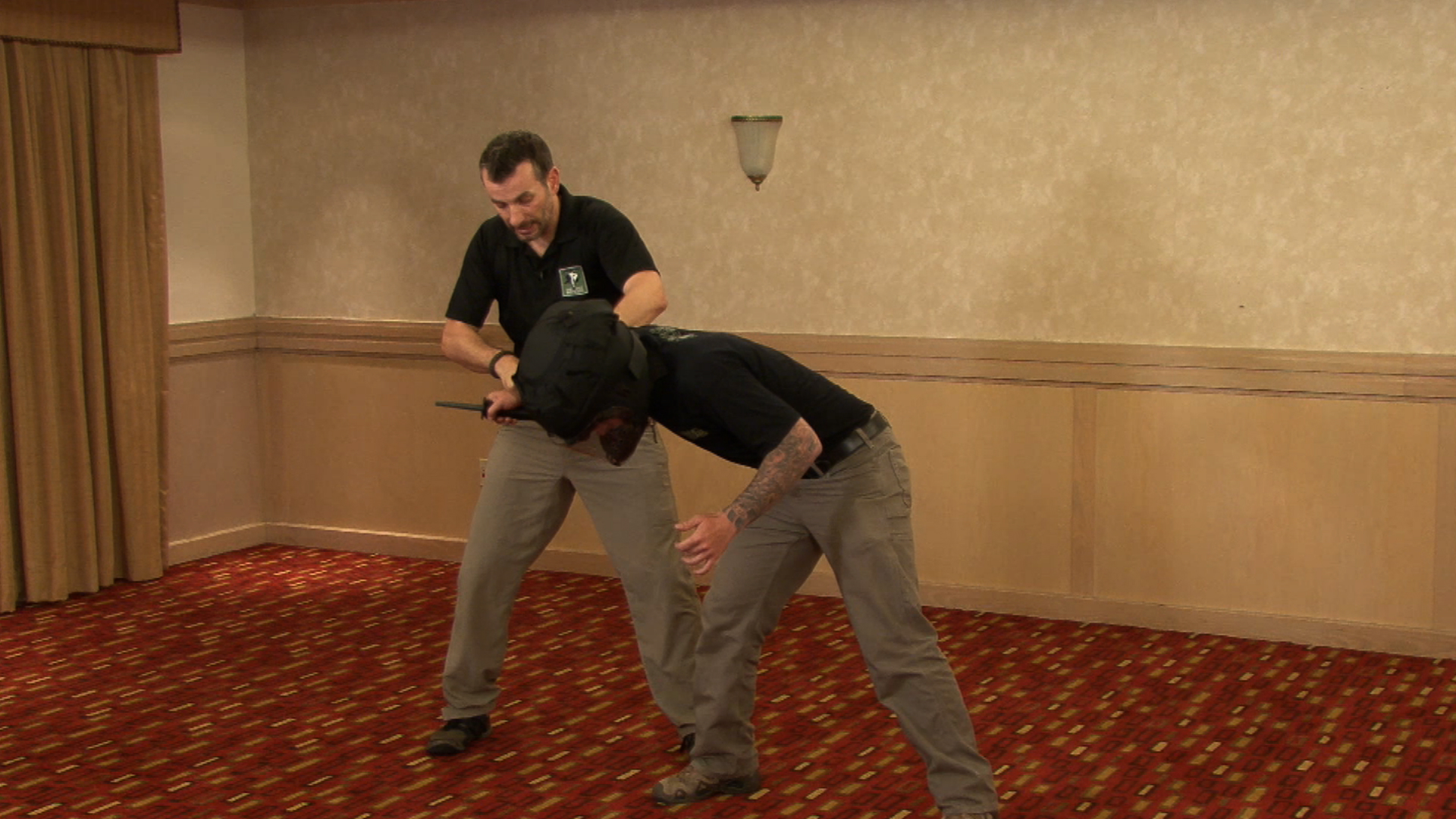 Two men doing a counter knife defense drill