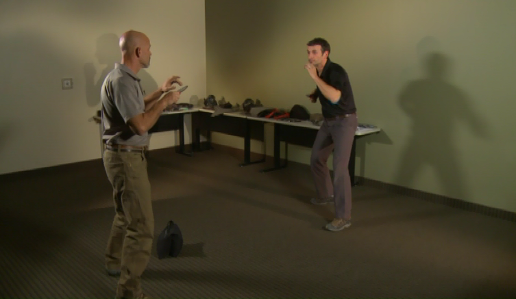 Two men practicing hand-to-hand defense