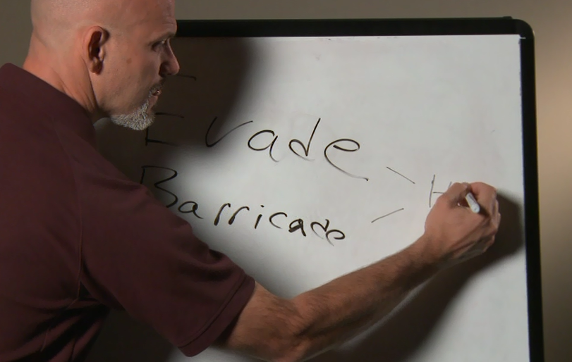 Man writing on a white board