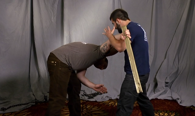 Two men practicing krav maga