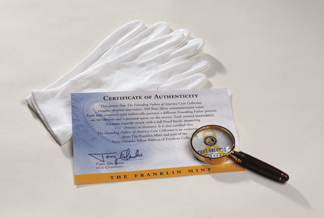 Certificate, gloves and a magnifying glass