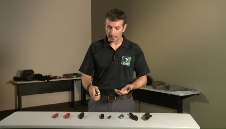 Man with defensive weapons on a table