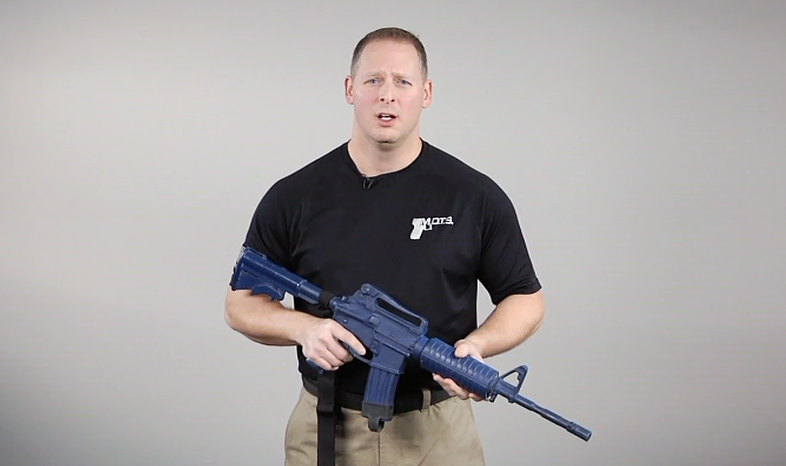 Man with a blue AR-15