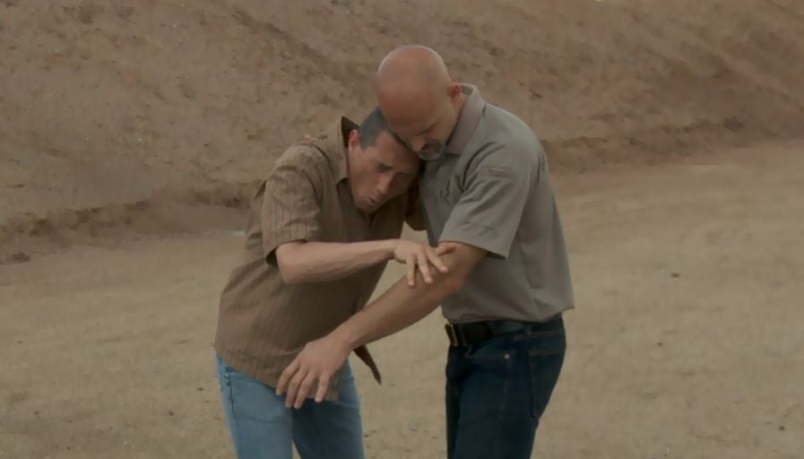 Two men practicing close quarter combat