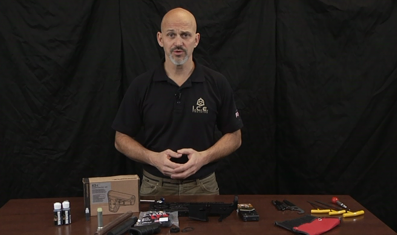 Man with gun accessories at a table