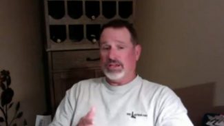 Screen shot of a man talking on video