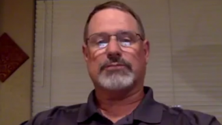 Screenshot from a video of a man talking