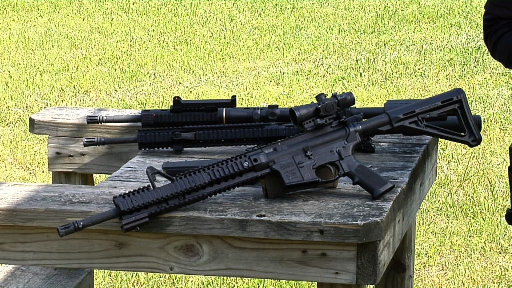 Two rifles outside on a table