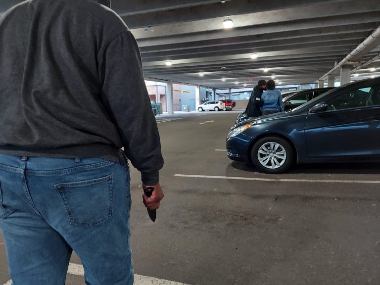 Simulation of a man with a gun in a parking garage