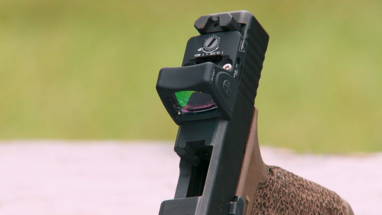 Close up of red-dot sight on a gun