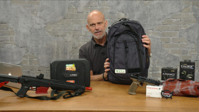 Man holding a Vertx backpack