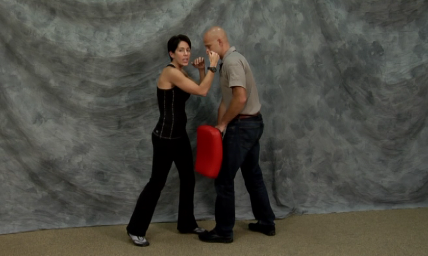 Woman practicing self-defense