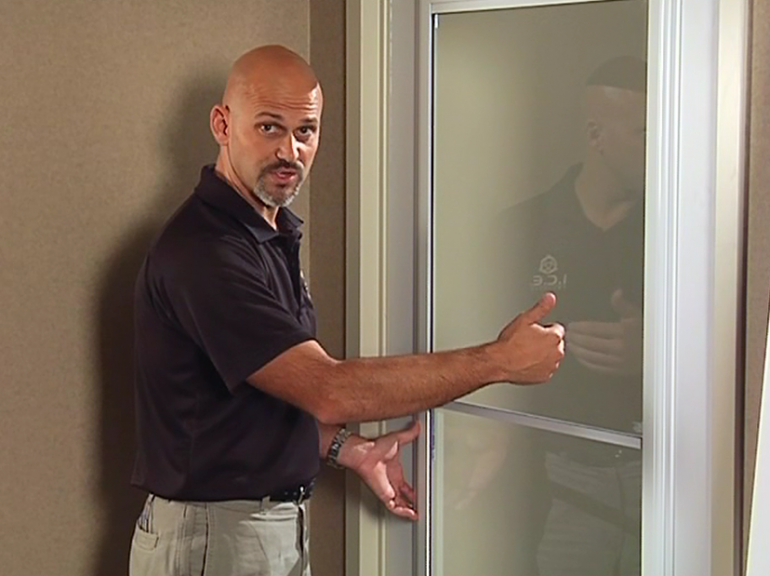 Man talking by a door