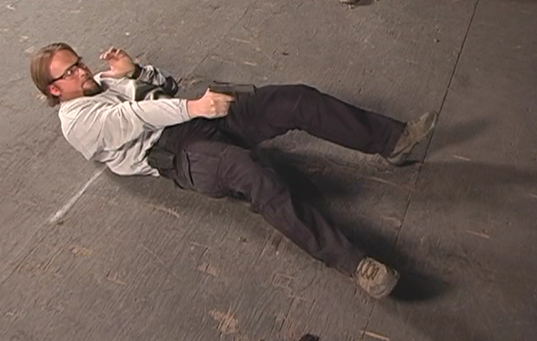 Man in a shooting position on his back