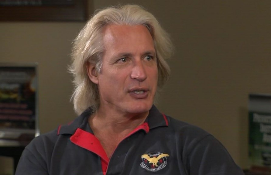 Man with longer hair talking