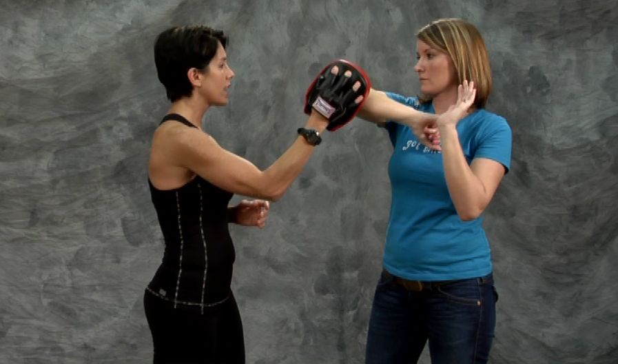 Woman teaching self defense