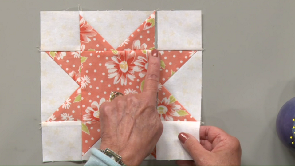 Floral fabric star quilt square