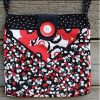 Black, white and red cross body bag
