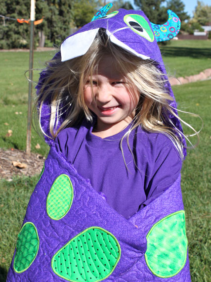 Purple and green cuddle monster nap wrap