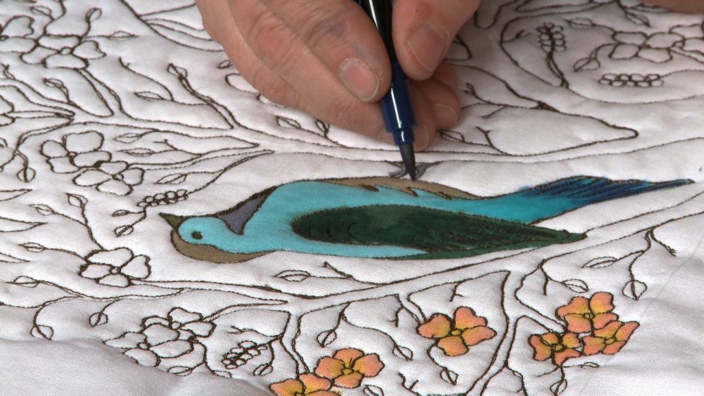 Coloring a bird on fabric