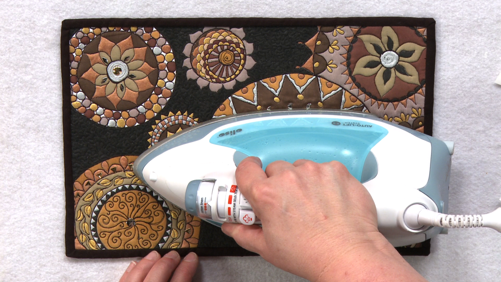 Ironing an embellished quilt