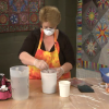 Woman mixing dye for fabric