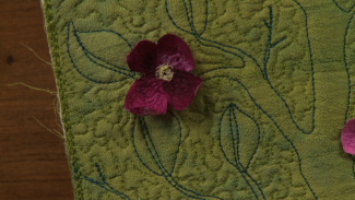 Cherry blossom on green fabric
