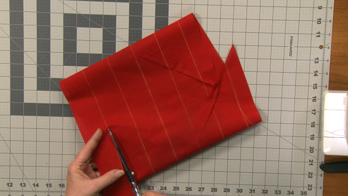 Cutting red fabric