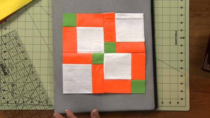 Green, orange and white fabric block