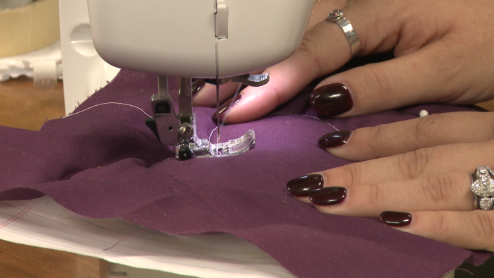 Sewing purple fabric