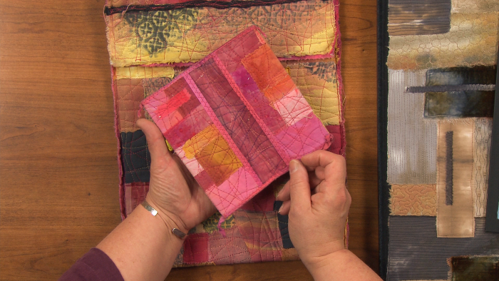 Quilting with pink folded fabric