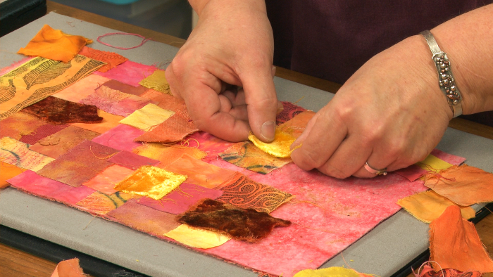Quilting with pink and yellow fabric pieces