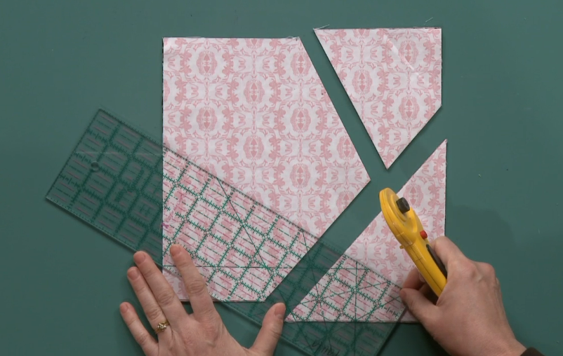 Cutting a fabric square into three pieces