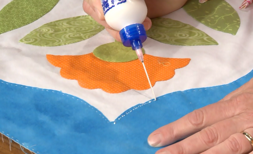 Putting glue on fabric