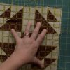Using a quilting ruler over fabric