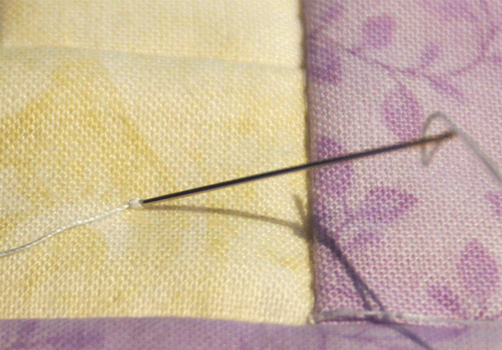 Needle with knotted thread